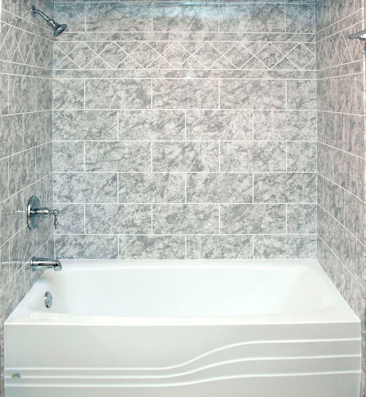 Elegant bathroom with a white bathtub and gray marble tile walls. The shower and faucet are chrome, adding a clean, modern feel.
